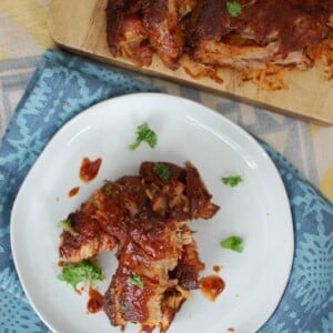 Slow Cooker Barbecue Ribs are fall off the bone tender and full of warm spices and flavor. These ribs cook in a slow cooker saving you time and making this meal easy and perfect for a crowd!