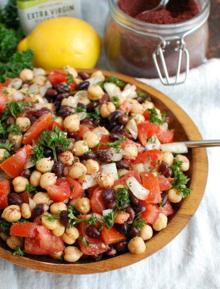 Balela Salad is a light and healthy salad mixing chickpeas, black beans, tomatoes, onion and parsley topped with a lemony sumac dressing with a hint of spice. This works great as lunch, as a side to dinner or topping to your pita, rice bowls or alongside grilled chicken or seafood. 