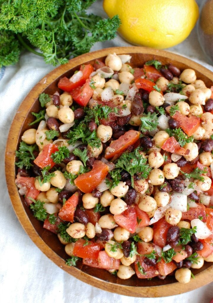 Balela Salad is a light and healthy salad mixing chickpeas, black beans, tomatoes, onion and parsley topped with a lemony sumac dressing with a hint of spice. This works great as lunch, as a side to dinner or topping to your pita, rice bowls or alongside grilled chicken or seafood. 