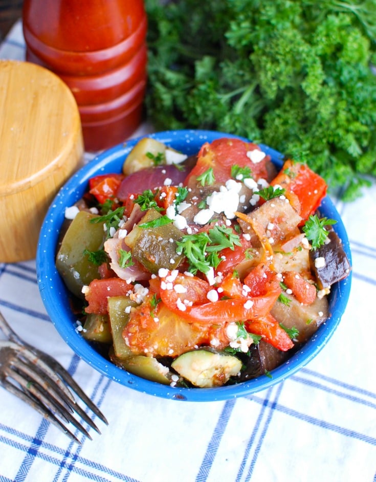Greek Roasted Vegetables {Briami} are tender, flavorful vegetables that are roasted in a tomato based sauce and topped with fresh parsley and feta cheese. These vegetables work great over rice, paired with pasta or as a side dish to your meal. 