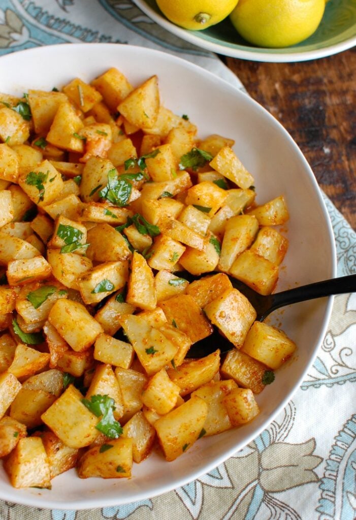 Spicy Lebanese Potatoes are crisp on the outside, tender on the inside and will spice up any meal. The sauce on these potatoes is the star featuring coriander, paprika, cayenne pepper mixed with olive oil and lemon juice. The dish is finished off with your favorite herb, cilantro or parsley. 