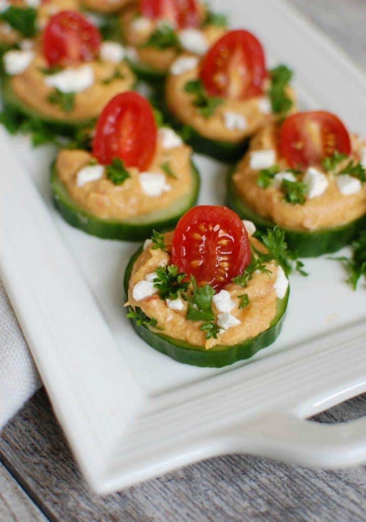 Cucumber Hummus Bites on white platter