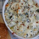 Lemon Spinach Artichoke Dip in white bowl