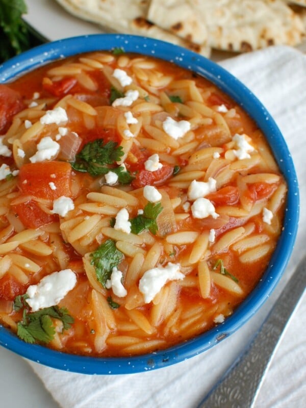 One Pot Creamy Tomato Herb Orzo in Blue Bowl