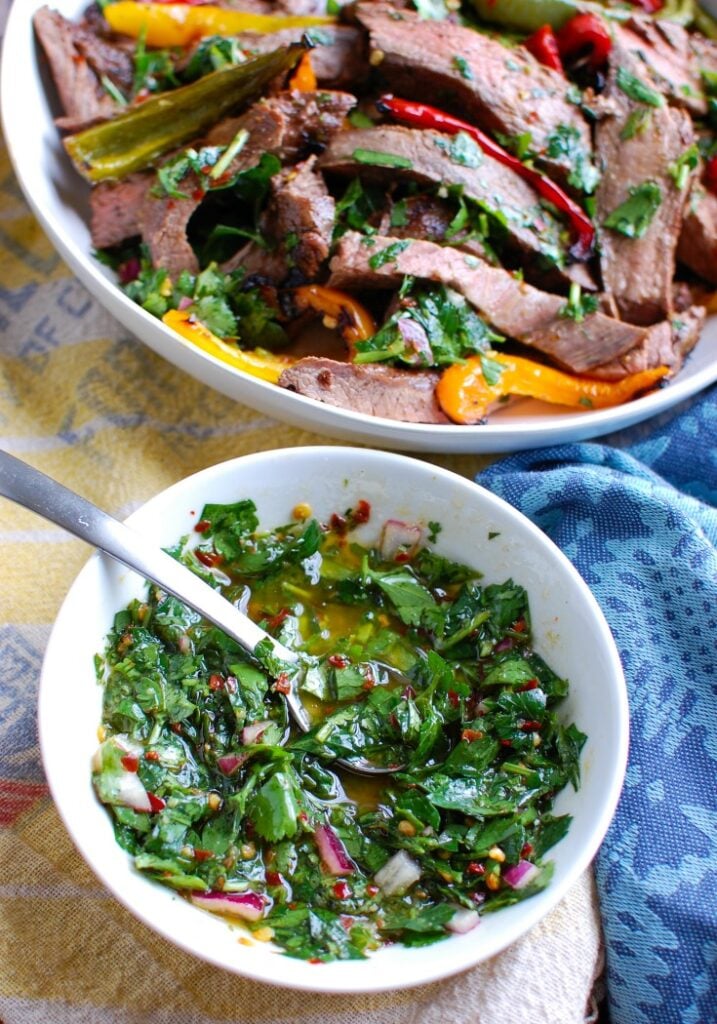 Easy Grilled Flank Steak with Chimichurri Sauce up close on the sauce