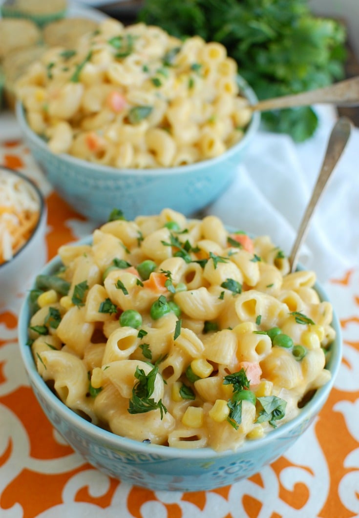 Instant Pot Vegetable Mac and Cheese in blue bowl with spoon