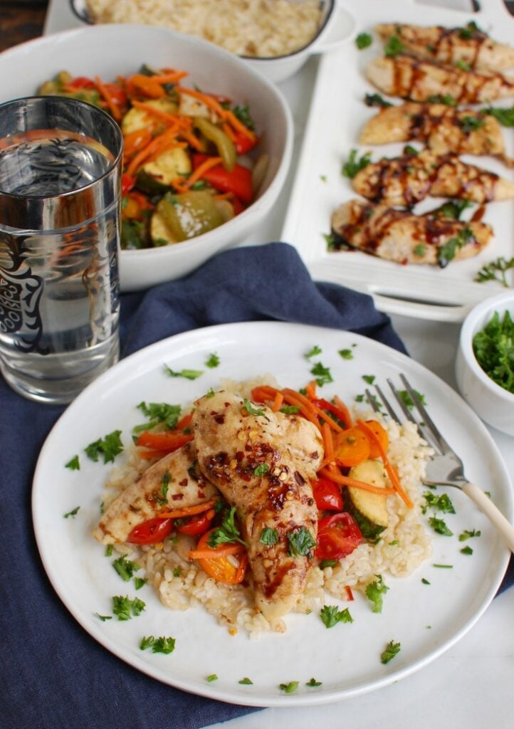 Sheet Pan Honey Balsamic Chicken Tenders and Vegetables White Plate Far Away