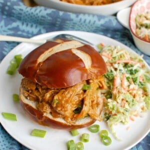 How to Make Pork Tenderloin in the Slow Cooker Sandwich on White Plate