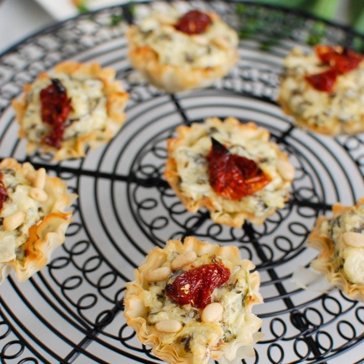 Spinach Artichoke Sun-dried Tomato Phyllo Bites on wire rack