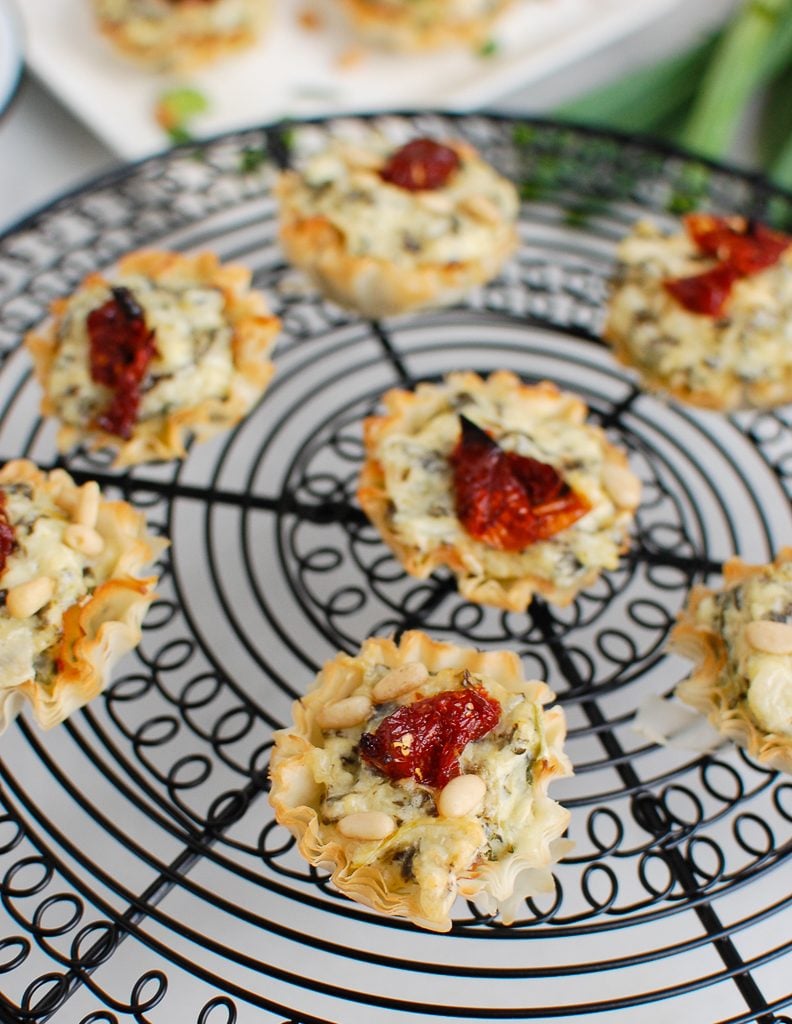 Spinach Artichoke Sun-dried Tomato Phyllo Bites on wire rack