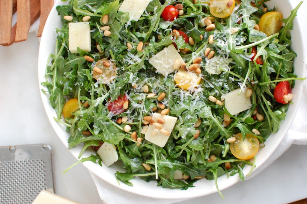 Lemon Arugula Salad with Pine Nuts in bowl 