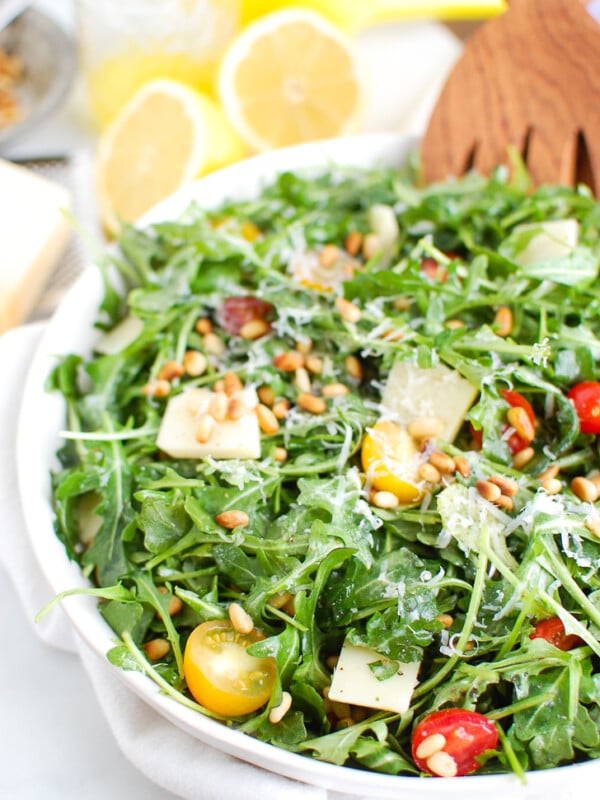 Lemon Arugula Salad with Pine Nuts White Bowl