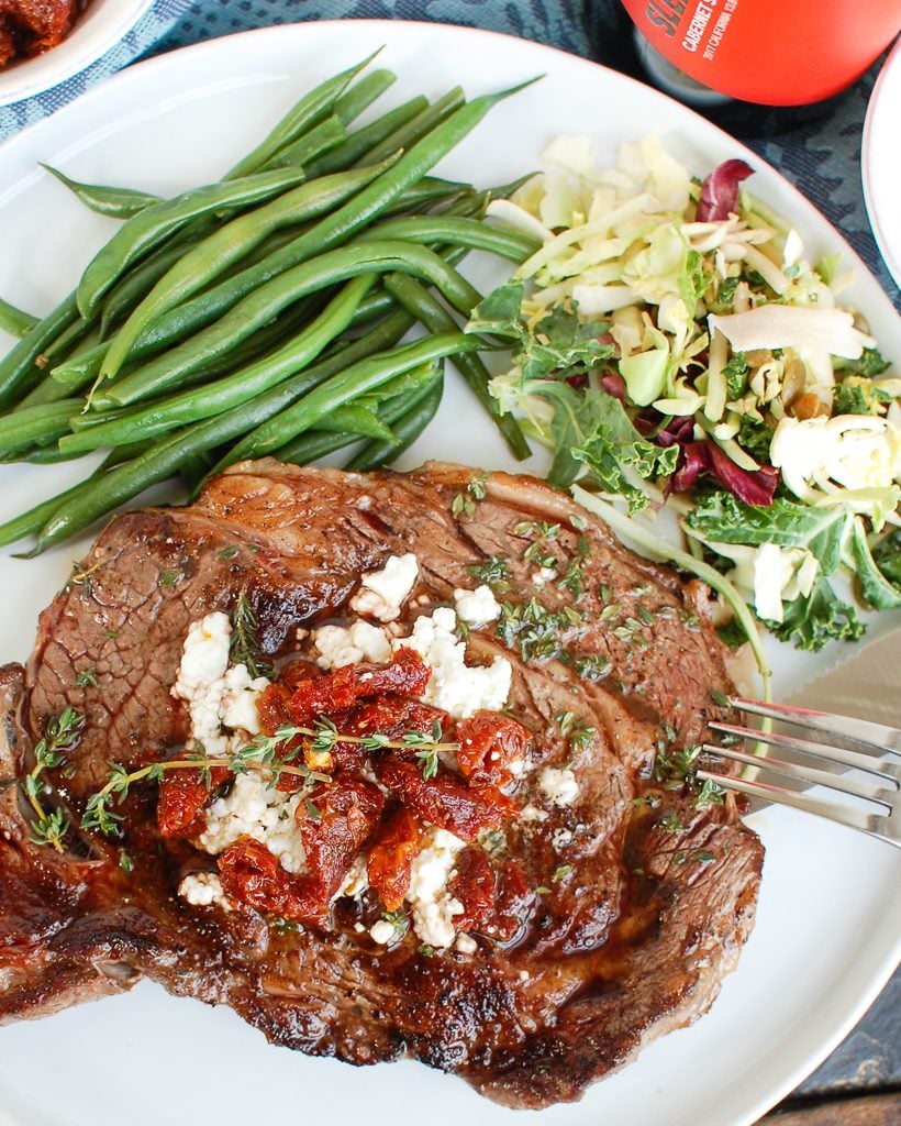 Pan-Seared Ribeye with Goat Cheese and Sun-dried Tomatoes with Green Beans
