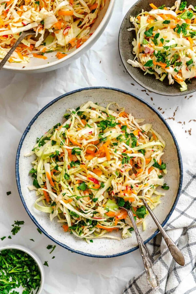 Healthy Coleslaw in bowl with fork