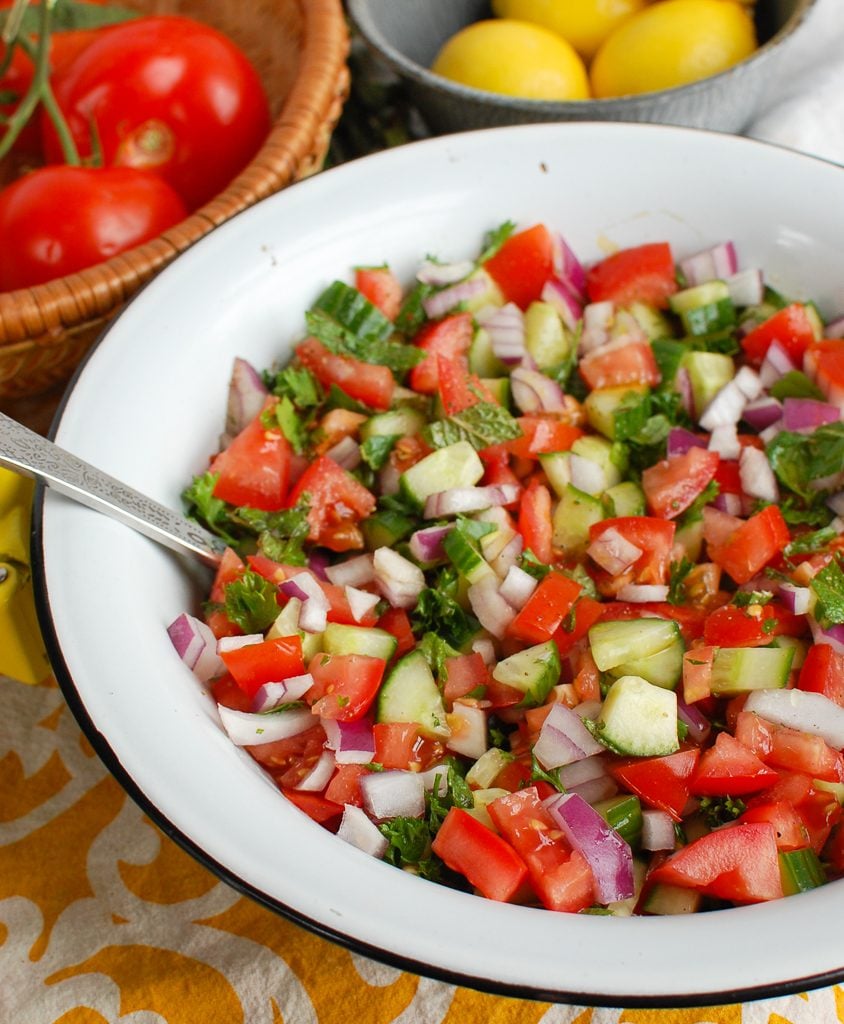 Israeli Salad in a Ceramic Bowl with Spoon 