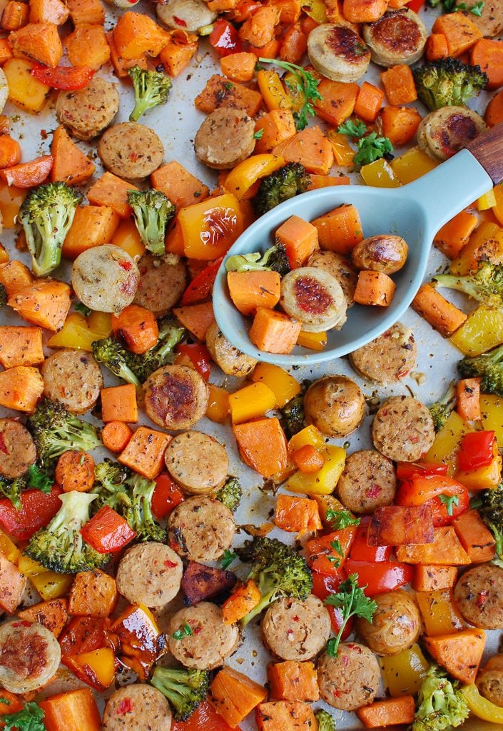 Sheet Pan Chicken Sausage and Vegetables with spoon 