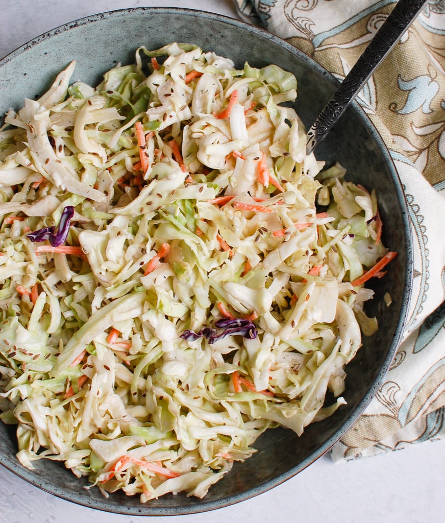 Creamy Coleslaw Recipe with blue bowl and spoon 