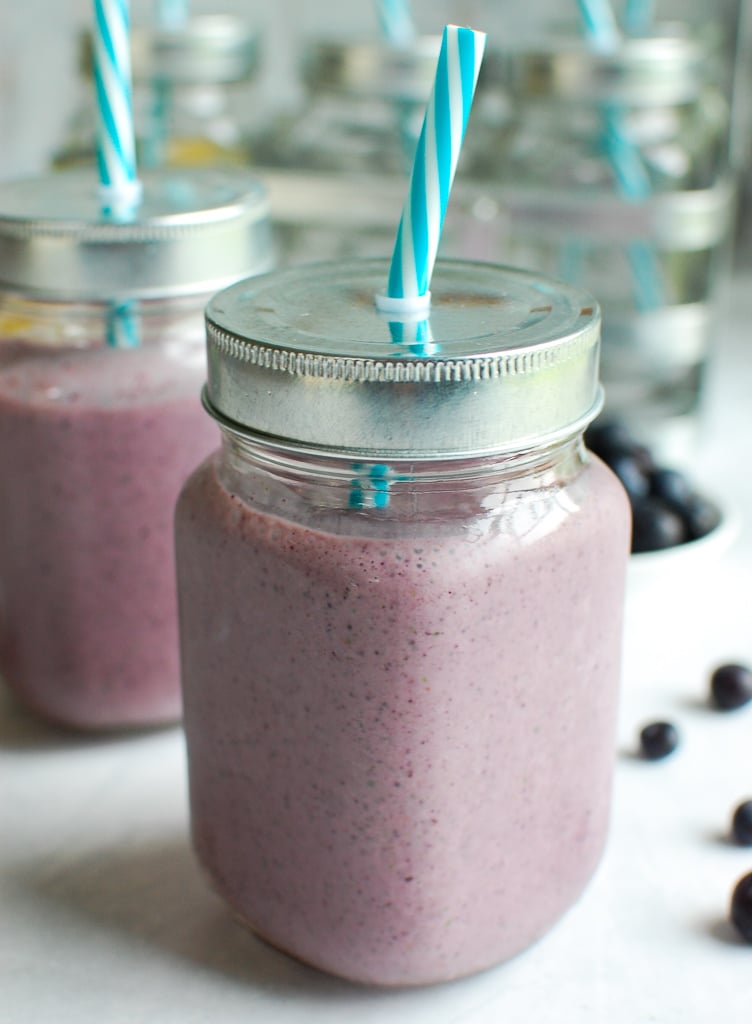 Blueberry Kale Smoothie with teal straw
