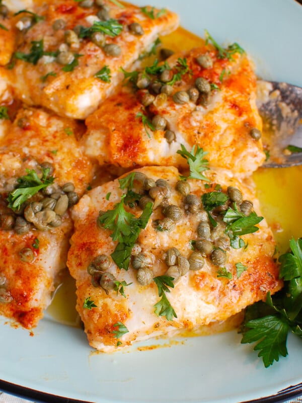 Baked Cod with Lemon on teal platter