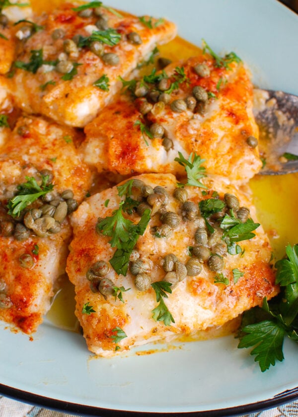 Baked Cod with Lemon on teal platter