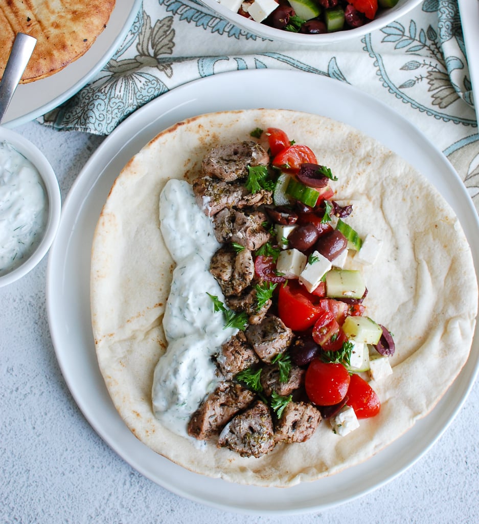Pork Souvlaki with Tzatziki on a plate. 