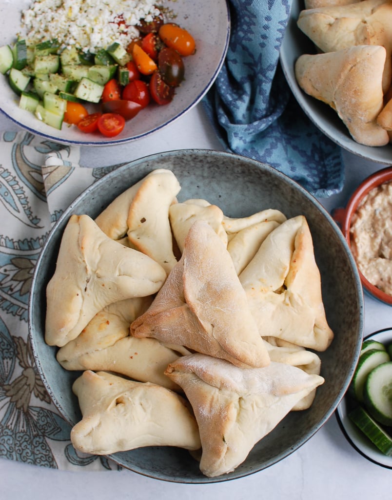 a bowl filled with spinach fatayer. 