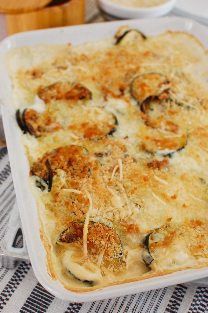 Zucchini Gratin in white casserole dish 