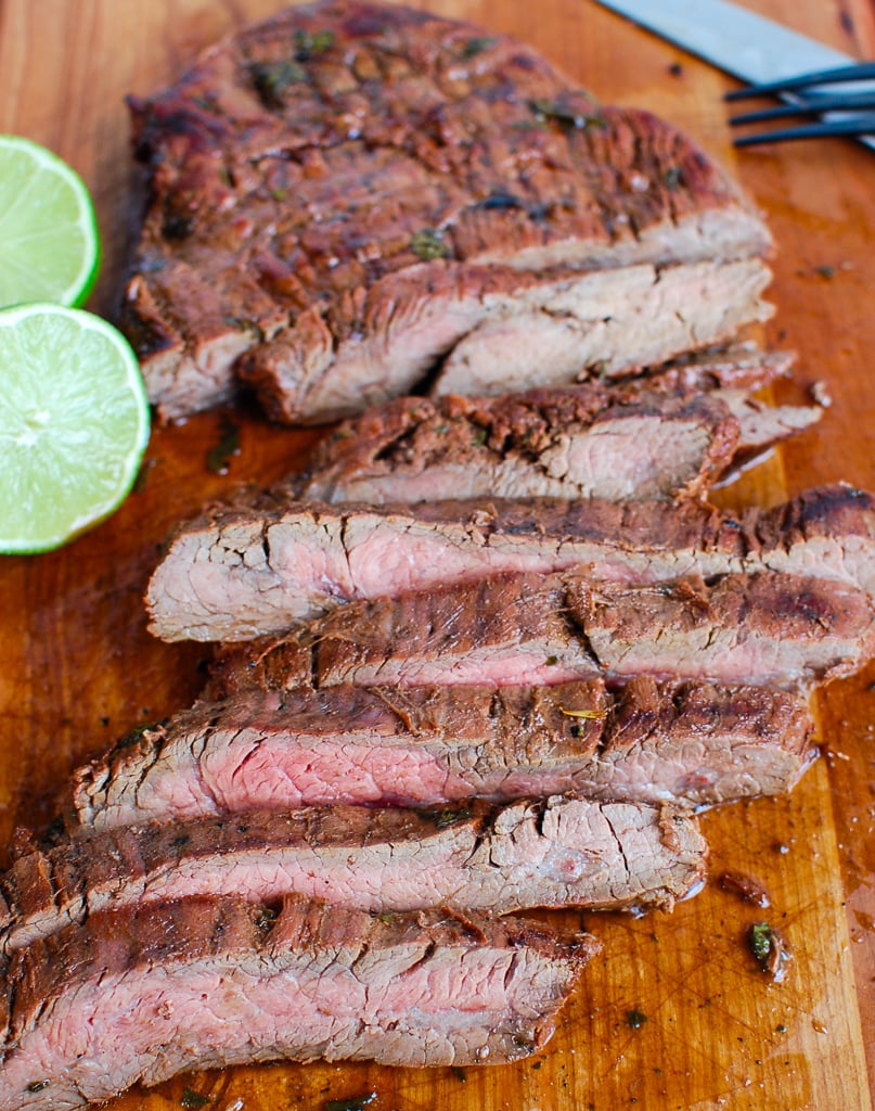 Grilled Carne Asada on cutting board with knife