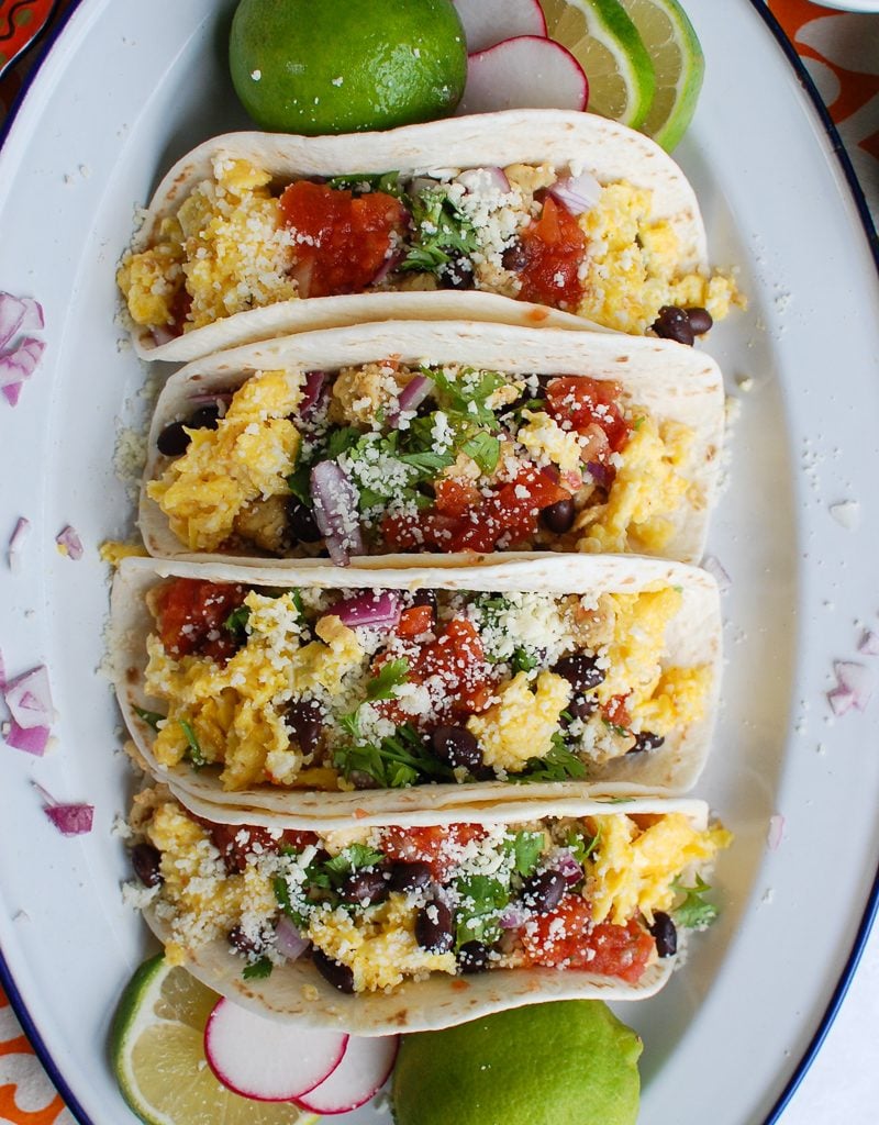 Southwest Breakfast Egg Tacos in white platter and onion