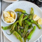 Shishito Peppers on white plate