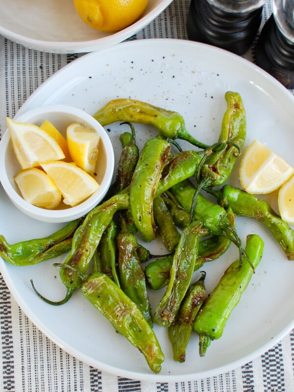 Shishito Peppers on white plate