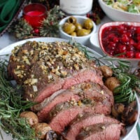 Rosemary and Garlic Roast Beef on a white platter