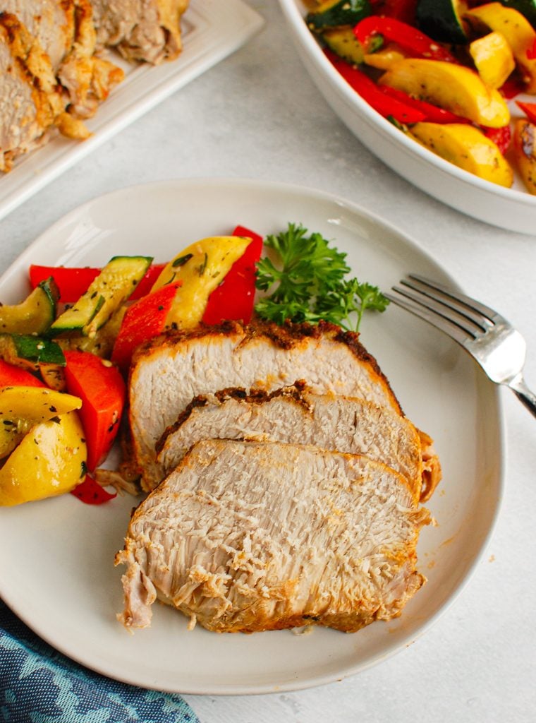 How to Cook Pork Loin in the Slow Cooker on white plate 
