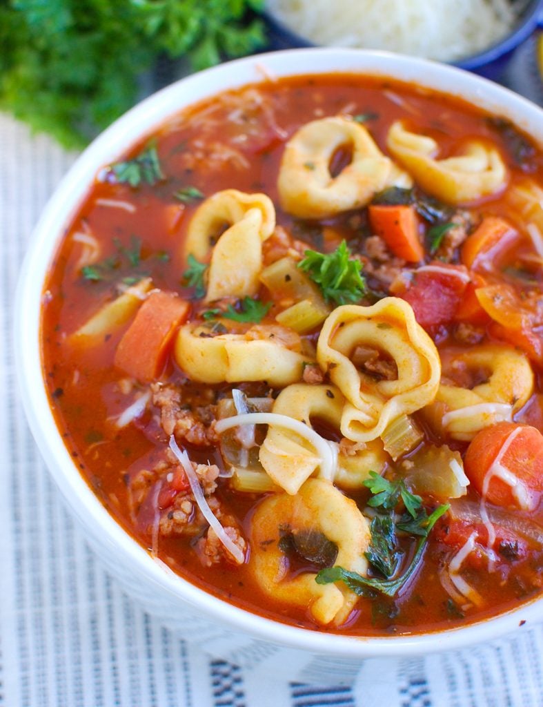 Tortellini Sausage Soup in white bowl