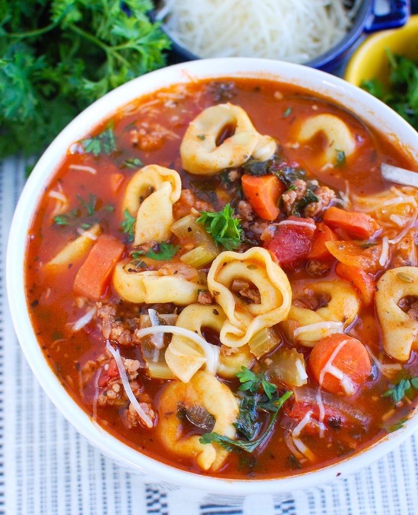 Tortellini Sausage Soup in white bowl 
