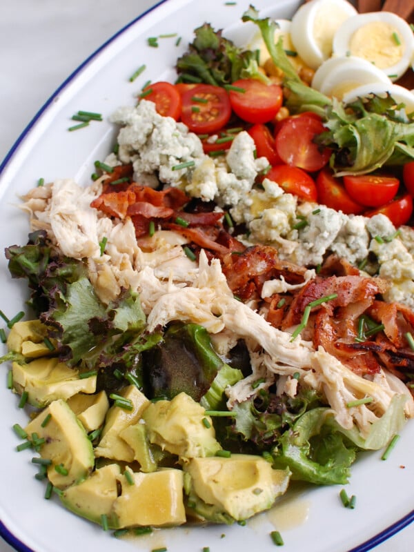 Cobb Salad Recipe with wooden tongs