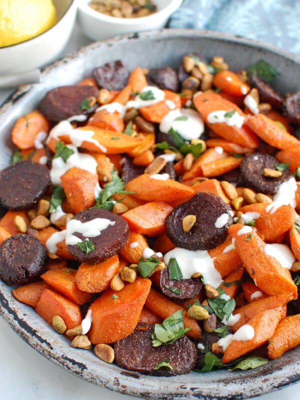 Roasted Carrots and Beets with Tahini on metal plate