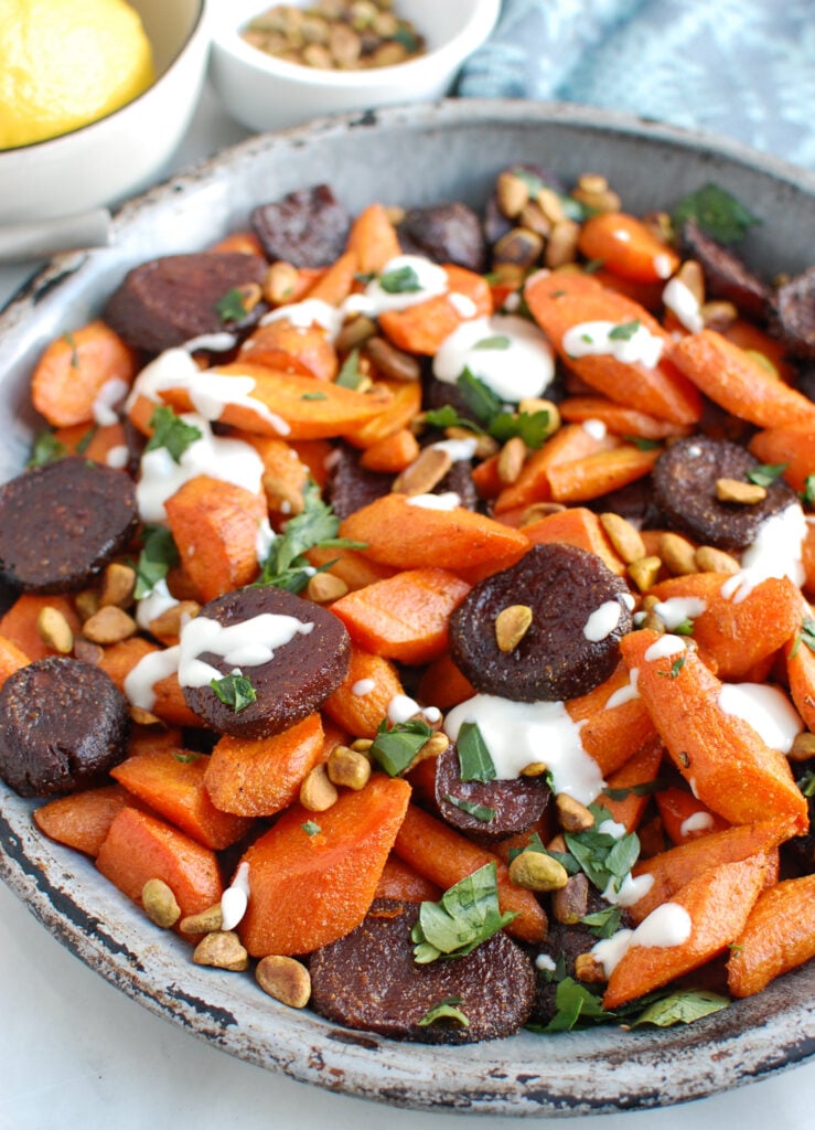 Roasted Carrots and Beets with Tahini on metal plate 