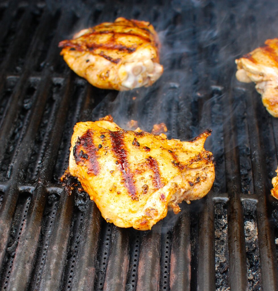 Grilled Chicken Thighs with Greek Marinade on grill