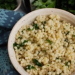 Lemon Pearl Couscous Recipe in white bowl.