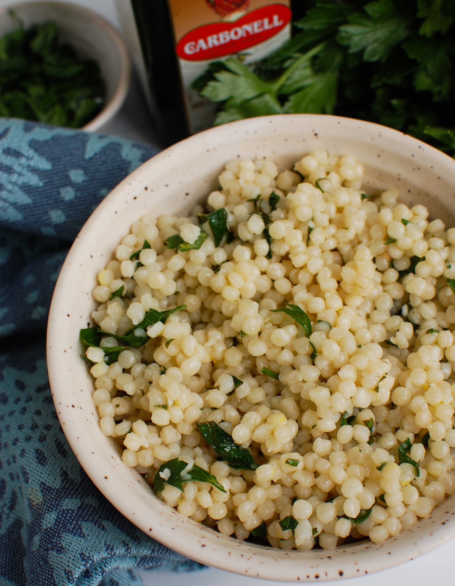 Lemon Pearl Couscous Recipe in white bowl.