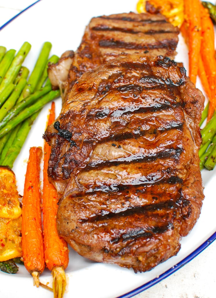 Lemon Garlic Butter Grilled Ribeye on cutting board 
