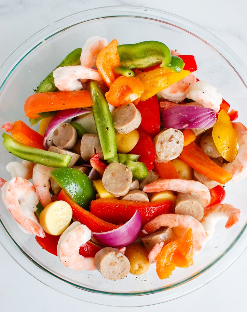 Sausage and Shrimp Foil Packets in a clear bowl