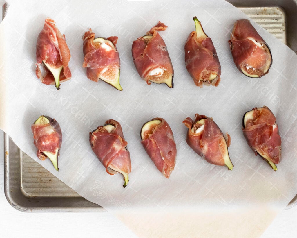 Goat Cheese Figs Wrapped in Prosciutto wrapped on plate 