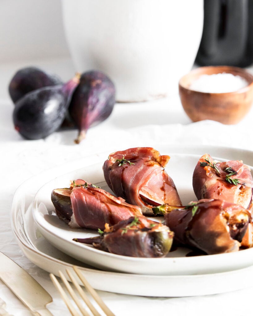 Goat Cheese Figs Wrapped in Prosciutto on plate
