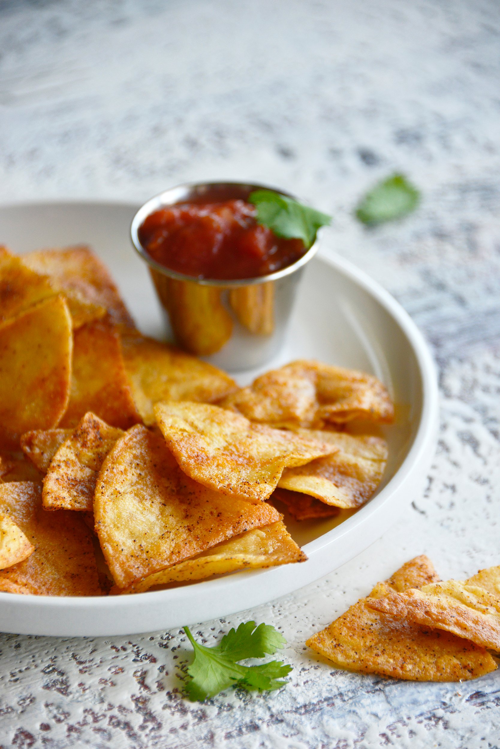 How to Make Chips with Tortillas on a white plate.