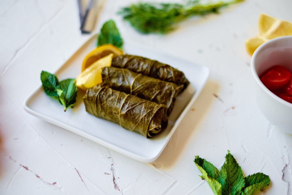 Stuffed Grape Leaves on white board