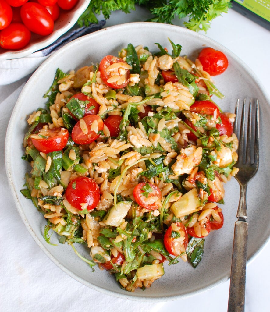 Tomato Feta Orzo Salad with fork 