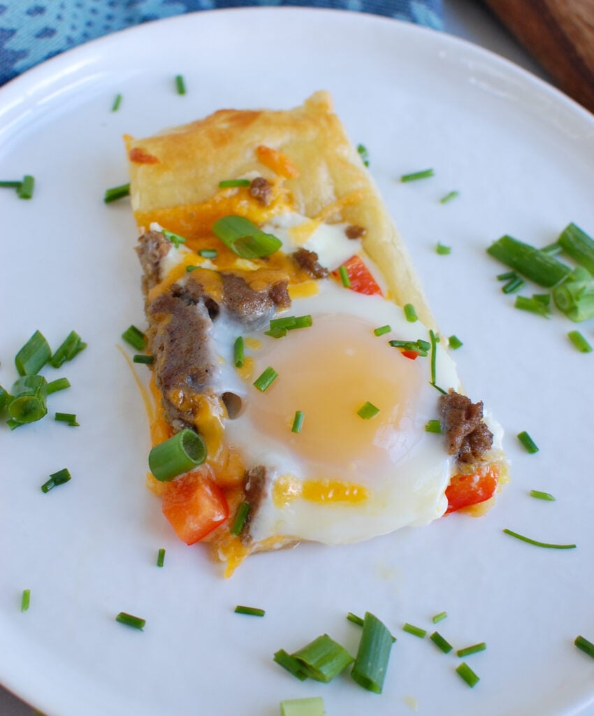 Turkey Sausage and Egg Puff Pastry Pizza on white plate 
