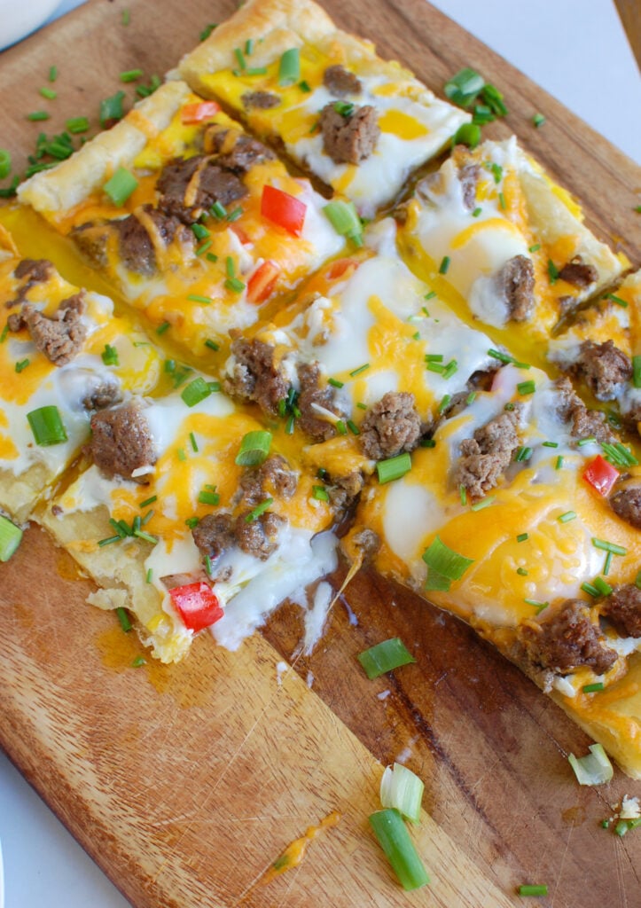 Turkey Sausage and Egg Puff Pastry Pizza on cutting board 
